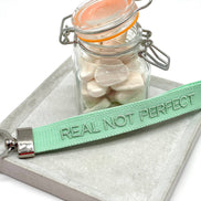 REAL NOT PERFECT woven embroidered keychain