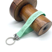REAL NOT PERFECT woven embroidered keychain
