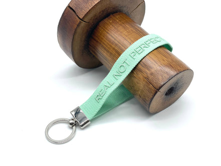 REAL NOT PERFECT woven embroidered keychain