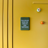 This House Runs On Snacks And Tantrums | Ceramic Magnet: Cornflower & Hunter Green