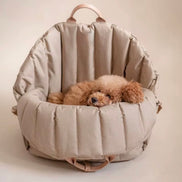 Padded dog car seat that converts into a travel bed and portable carrier for safe, stylish journeys