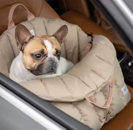 Padded dog car seat that converts into a travel bed and portable carrier for safe, stylish journeys