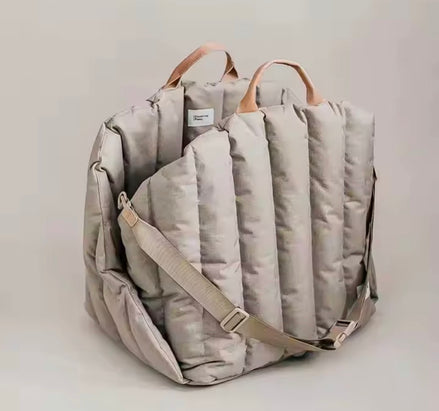 Padded dog car seat that converts into a travel bed and portable carrier for safe, stylish journeys