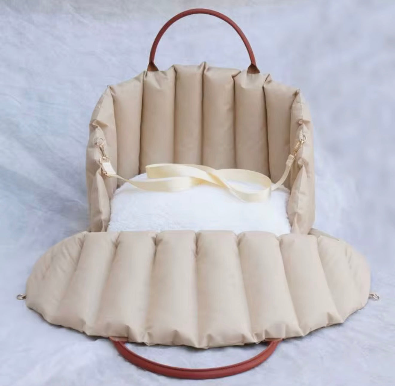 Padded dog car seat that converts into a travel bed and portable carrier for safe, stylish journeys
