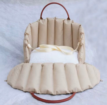 Padded dog car seat that converts into a travel bed and portable carrier for safe, stylish journeys