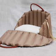 Padded dog car seat that converts into a travel bed and portable carrier for safe, stylish journeys