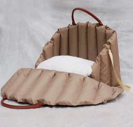 Padded dog car seat that converts into a travel bed and portable carrier for safe, stylish journeys