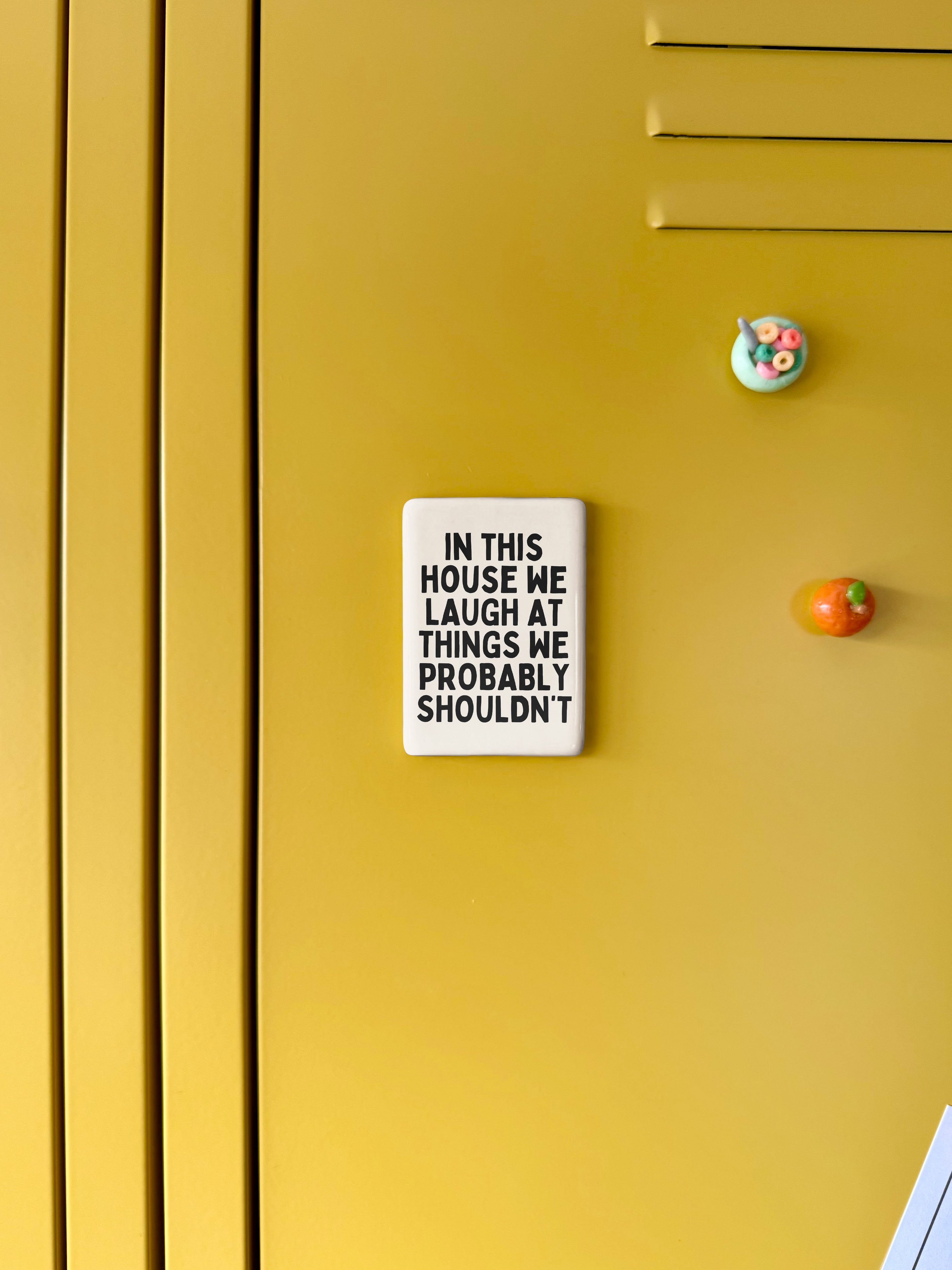 In This House We Laugh At Things We Probably Shouldn't | Ceramic Magnet: Black & Cream